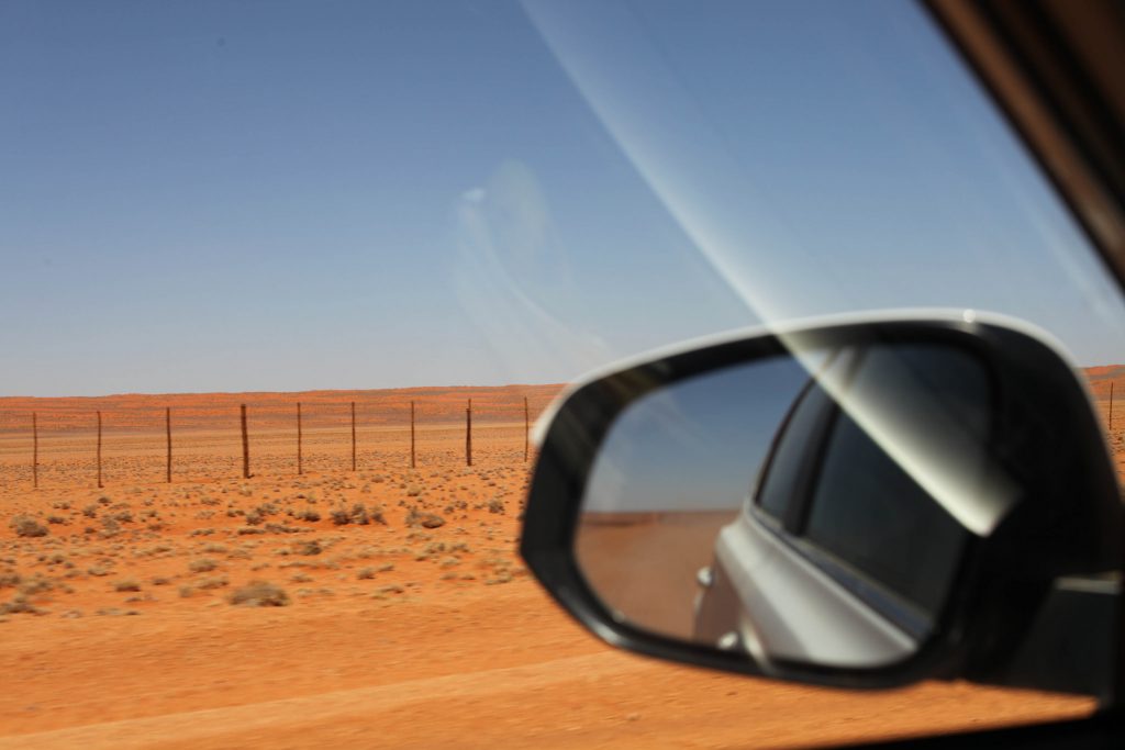 drivig on the D707 along the edge of the Namib desert